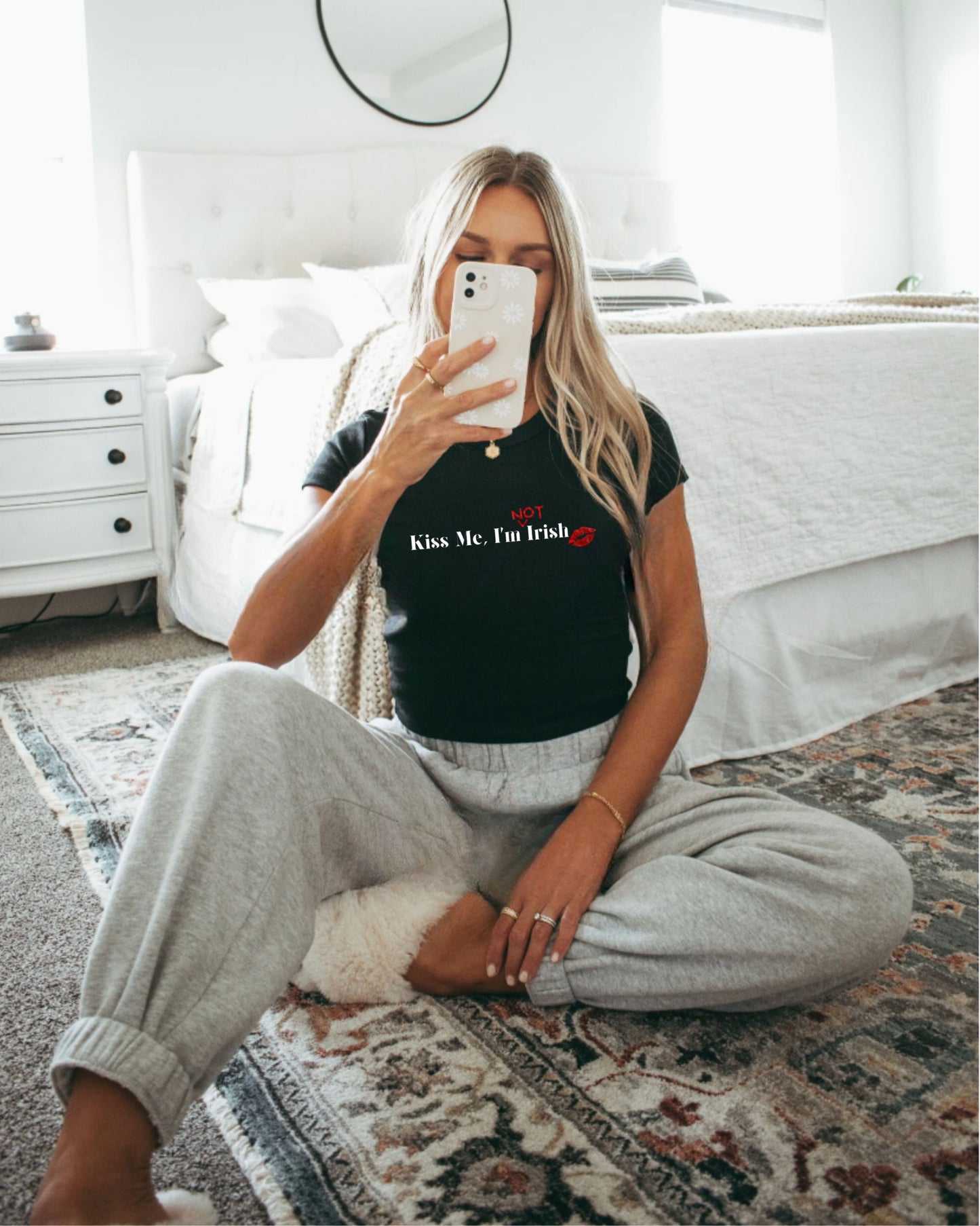 Cute girl mirror selfie in black Kiss Me, I'm (Not) Irish Baby Tee in white. Featuring a cute kiss mark design.