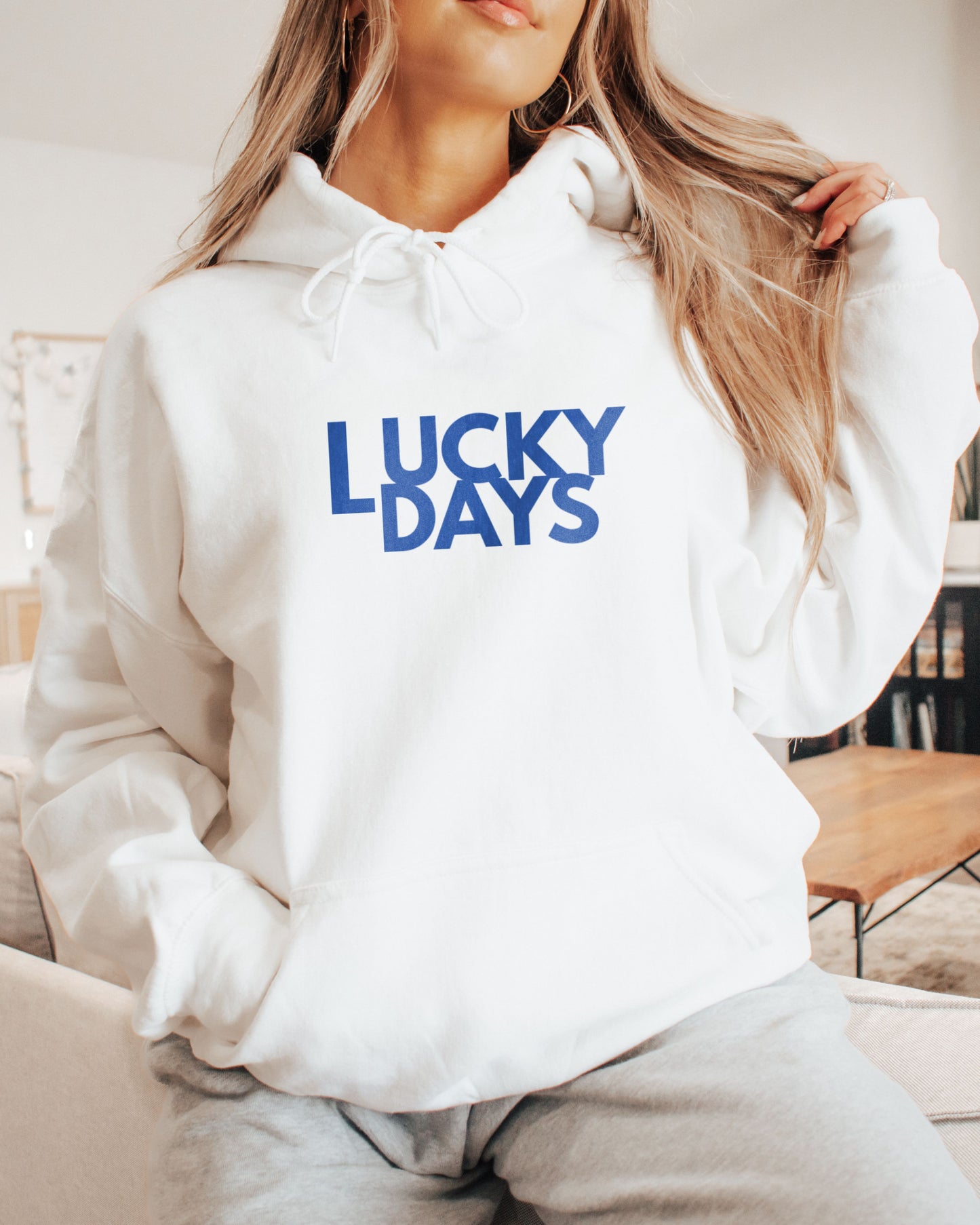 Girl in cute Lucky Days logo white hoodie