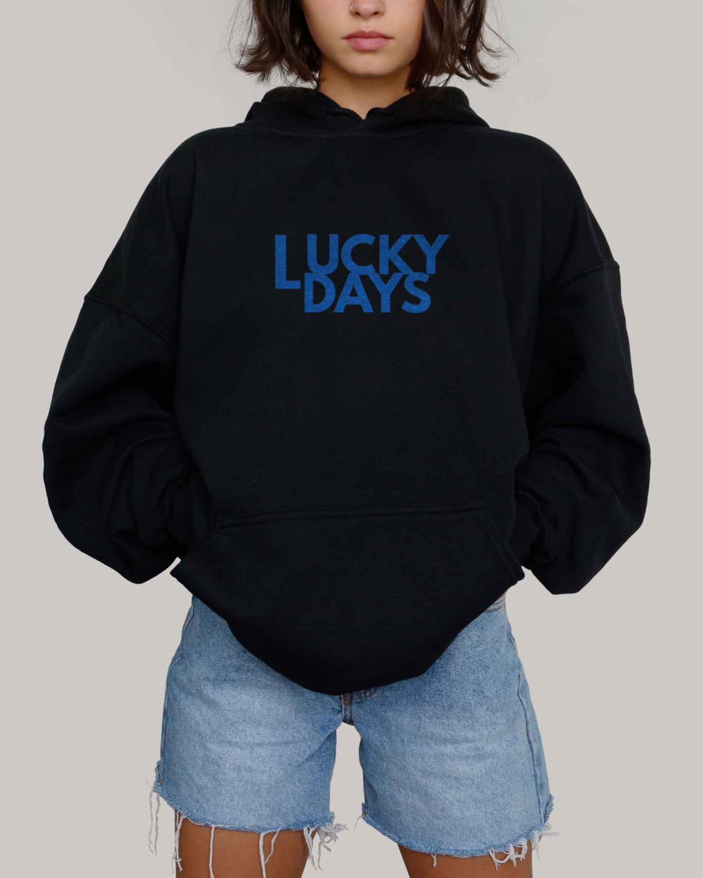Pretty model in Lucky Days logo black hoodie