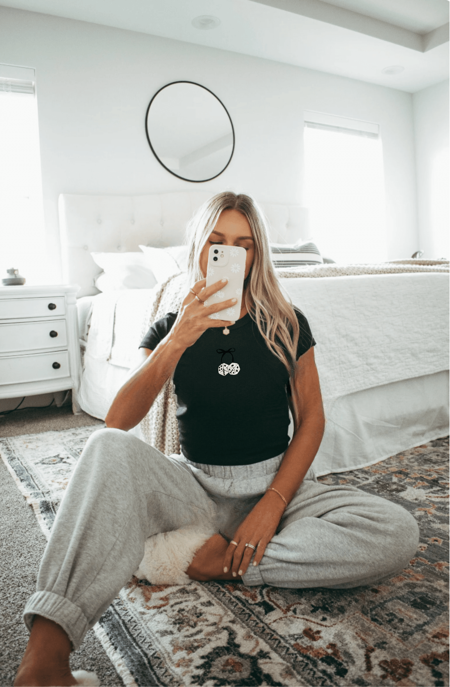 Girl in black Bow & Dice crop top in mirror. Cozy shirt in bed room.